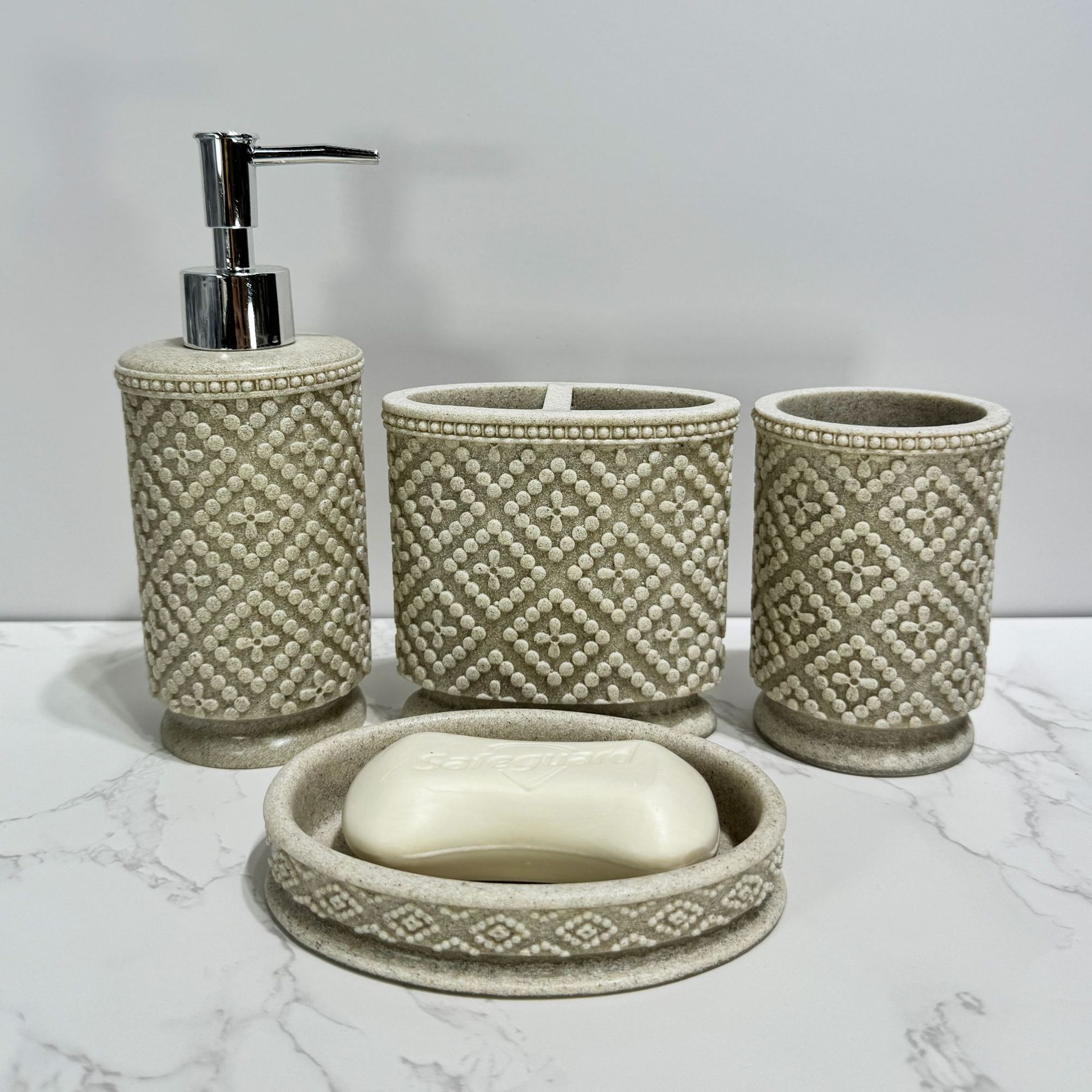 Diseño de piedra de arena imitación de resina set de enjuague de baño enjuague de baño de hotel decoración de piedra de arena set de cuatro piezas transfronterizo