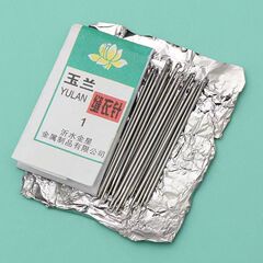 玉蘭牌の縫い目の古い伝統的な紙は手を縫います。