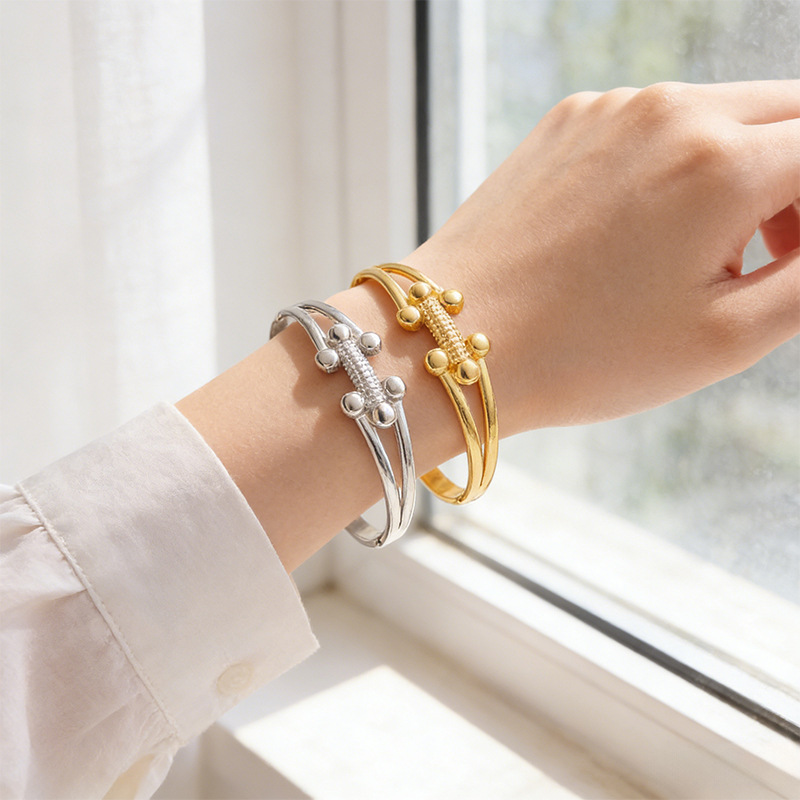 Brazalete de acero inoxidable de moda transfronteriza europea y americana lujo ligero de alto nivel sensación de bolas pequeñas h brazalete de apertura de oro mujer al por mayor