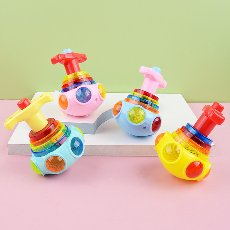 Juguete rojo neto para niños juguete emisor de luz música ligera giroscopio catapulta giratoria giroscopio emisor de luz puesto de regalo al por mayor