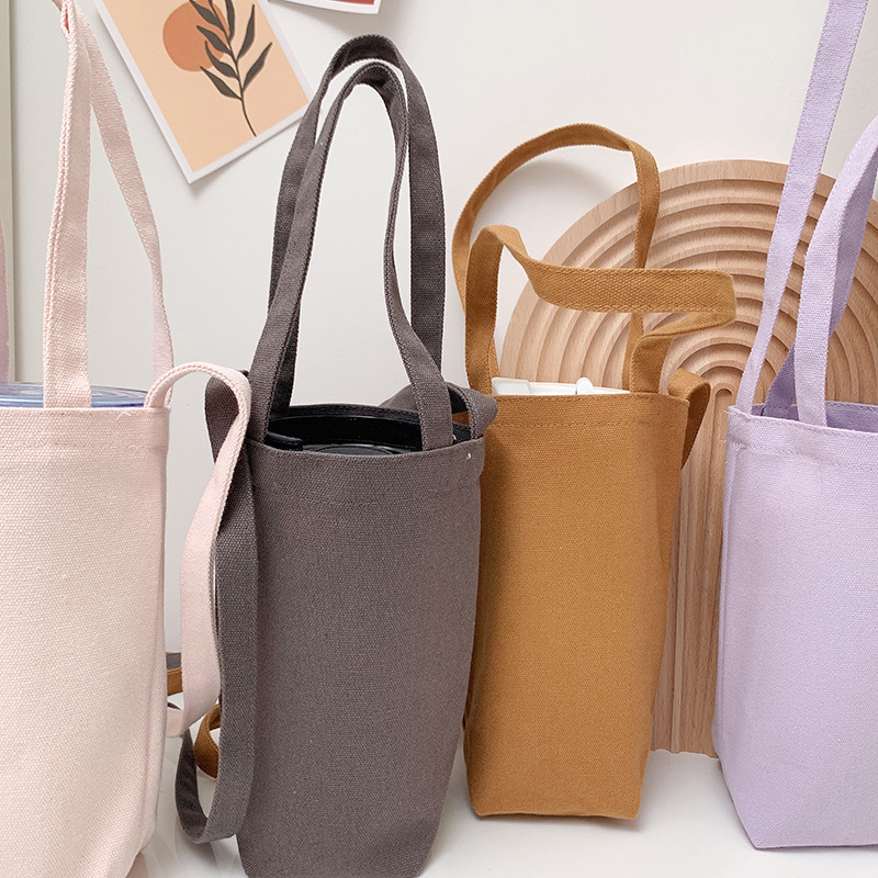 Bolsa de lona creativa portátil crossbody bolsa de paraguas bolsa de teléfono móvil cubierta de la caldera botella de agua bolsa de leche té aislado taza de agua cubierta