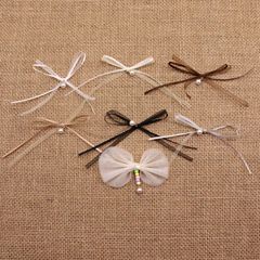 二重のリボンの蝶結びの手作りの縫い目のビーズのリボンのアクセサリーの部品のdiyの靴の靴下の帽子の服装の装飾のアクセサリ