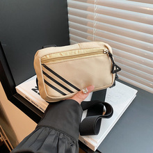 迷你斜挎包女学生胸包新款条纹背包潮牌手机包百搭男生情侣单肩包