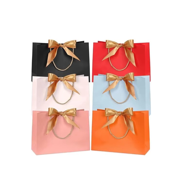 Waterproof Colorful Paper Bags with Gold Bow Ribbons, Suitable for Baby Showers, Weddings, Parties, Birthdays, and Holidays