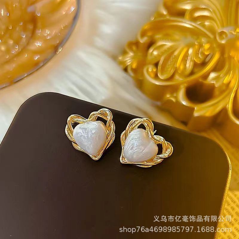 S925 Pendientes de perlas de temperamento Pendientes de lujo ligero de alta gama Pendientes al por mayor y al por menor transfronterizos Mujeres