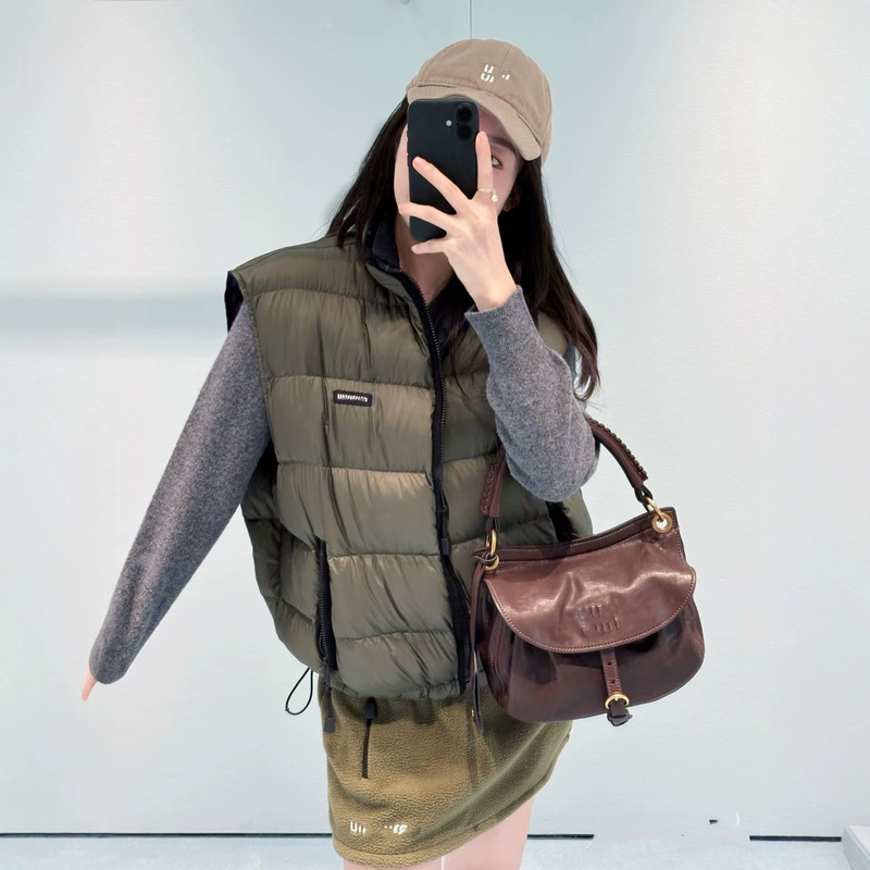 Shenzhen Nanyou High-End Women's Clothing Letter Logo Embroidery Military Green White Goose Down Warm Stand Collar Down Vest for Women Shenzhen Nanyou High-End Women's Clothing Letter Logo Embroidery Military Green White Goose Down Warm Stand Collar Down Vest for Women