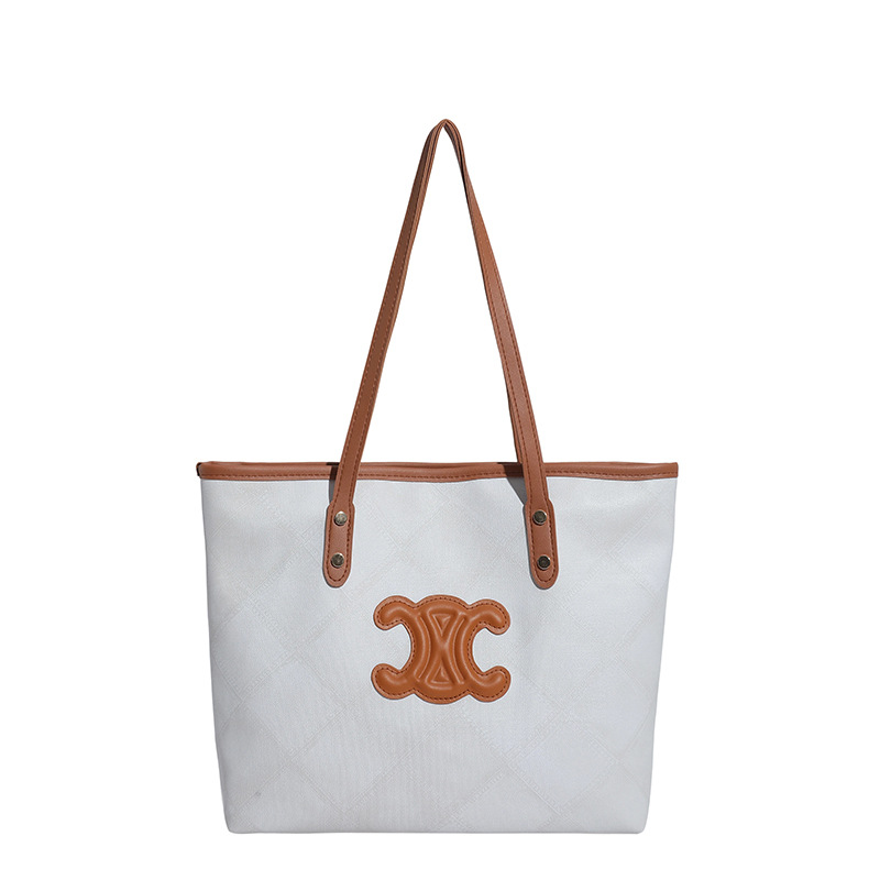 Bolsa de mano transfronteriza de gran capacidad para mujeres 2025, nueva sensación de alta calidad, bolso de hombro de viaje universal, bolso de moda