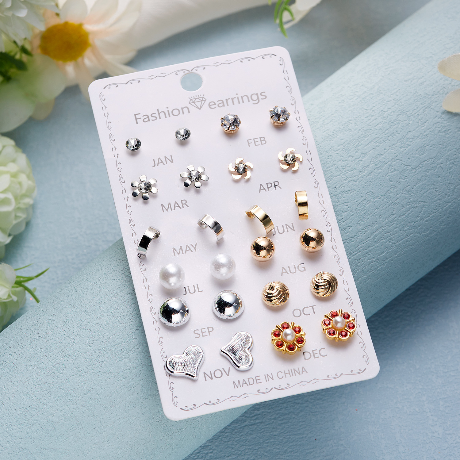 Set de aretes florales con perla y diamantes