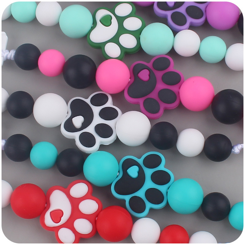 Nuevo bebé suministros dibujos animados perro garra goma creativo bebé lindo silicona mordedura pezón cadena anti-gota cadena