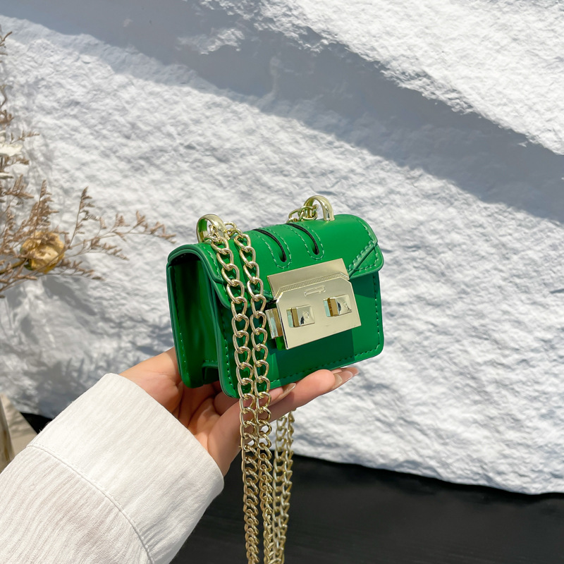 2024 principios de otoño nueva cadena de viaje bolso pequeño nicho personalidad ins cadena de hombro mini bolsa de cambio