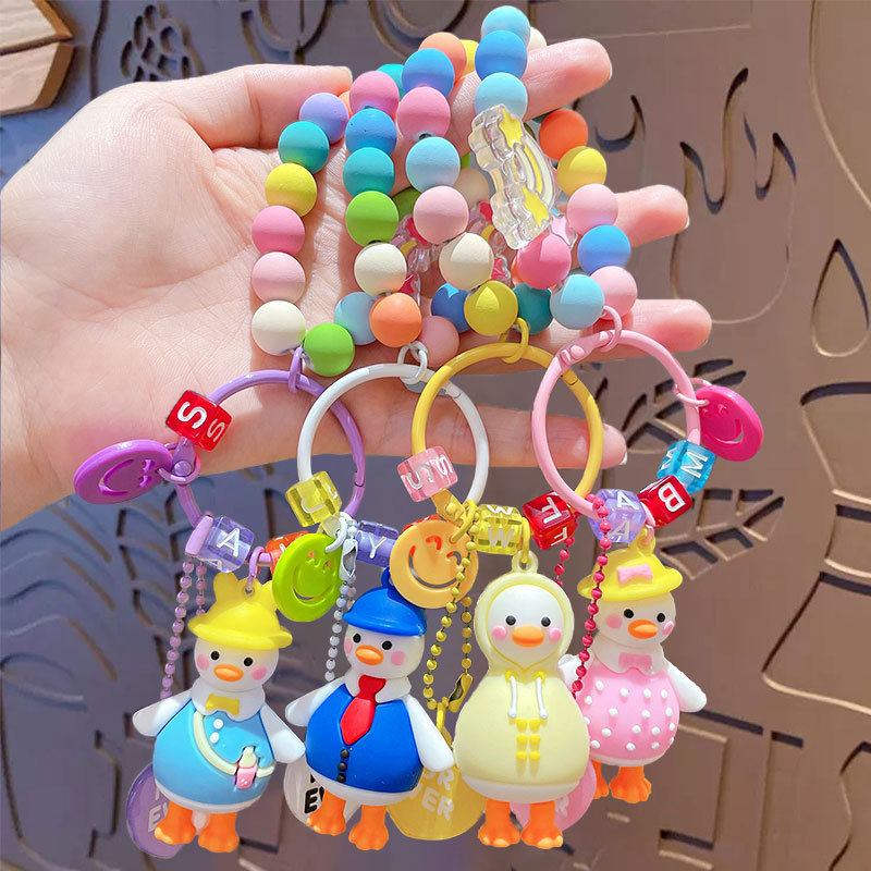 Caricatura creativa adorable pato cuentas colgante de cadena para mujeres lindas parejas llaveros bolsos colgantes pequeños regalos