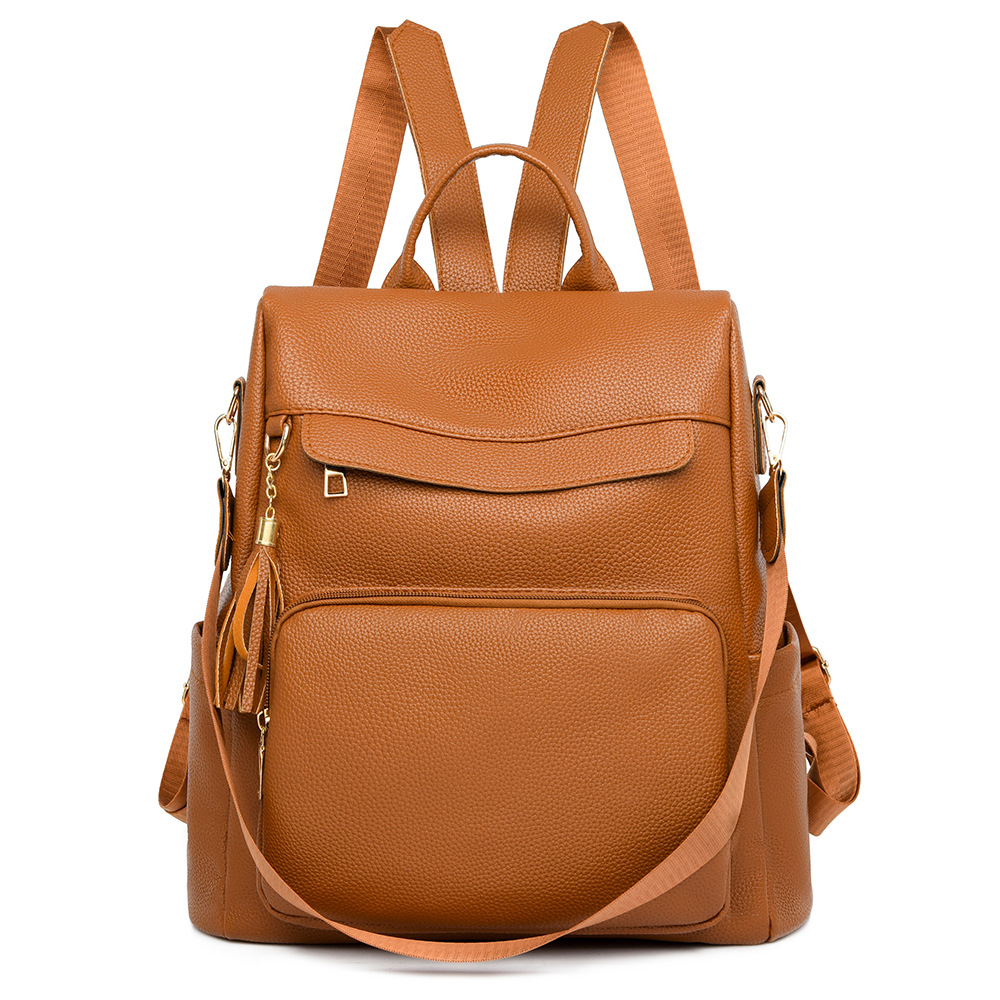 2024 nuevas damas casuales de cuero suave mochila antirrobo moda borla color de contraste mochila de viaje de gran capacidad al por mayor