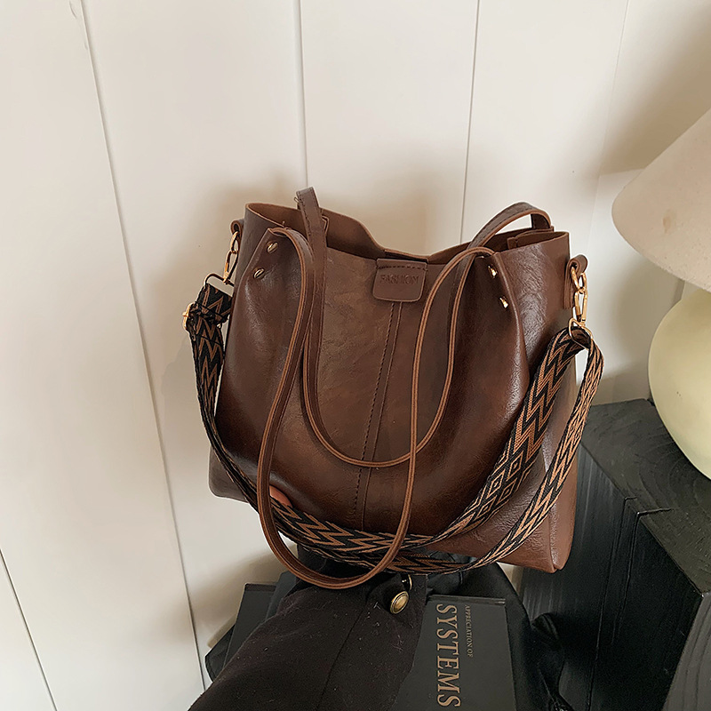 Europa y los Estados Unidos retro gran capacidad de transporte tote2025 nuevo bolso textura ancha cintura de hombro mochila bolso de hombro