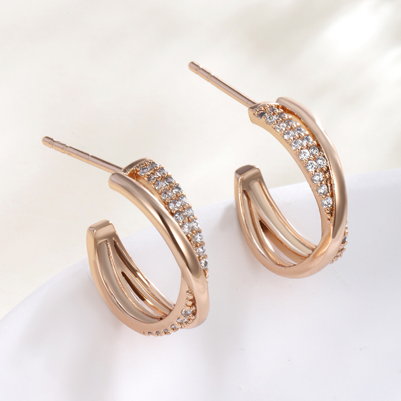 Xuping temperamento medio arco hueco diamantes pernos cruzados de moda japonesa y coreana diseño dulce pendientes lujosos para mujeres