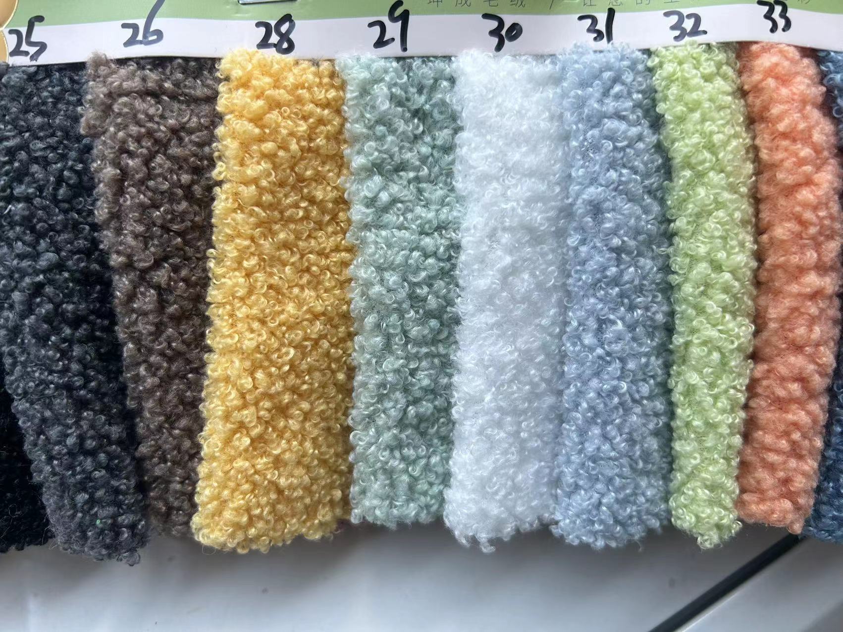Super suave tela de terciopelo de peluche llanura pequeña partícula poliéster felpa abrigo ropa de tela de juguete para niños en stock