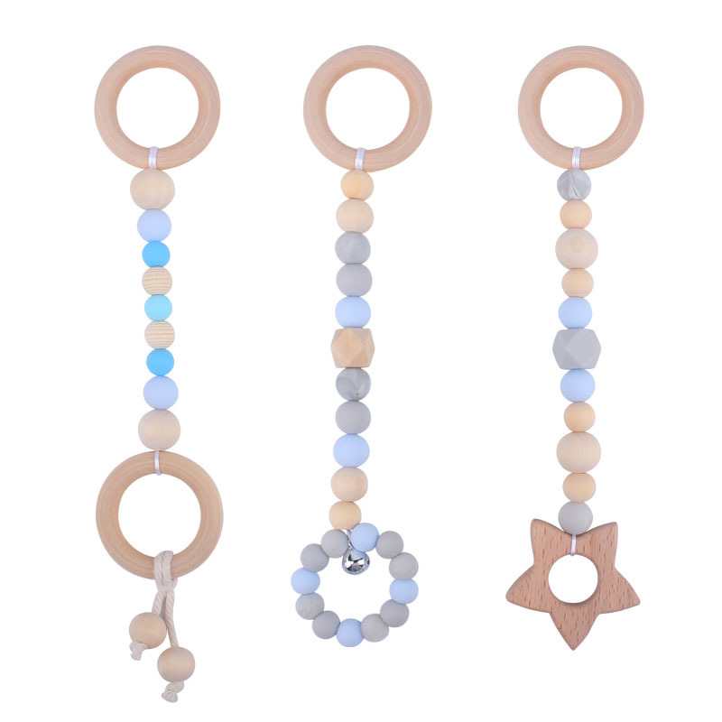 Nuevo Bebé calmante juguetes traje bebé cuentas de silicona haya molares mordedor juguetes pequeña campana Amazon