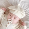 White knitted beret
