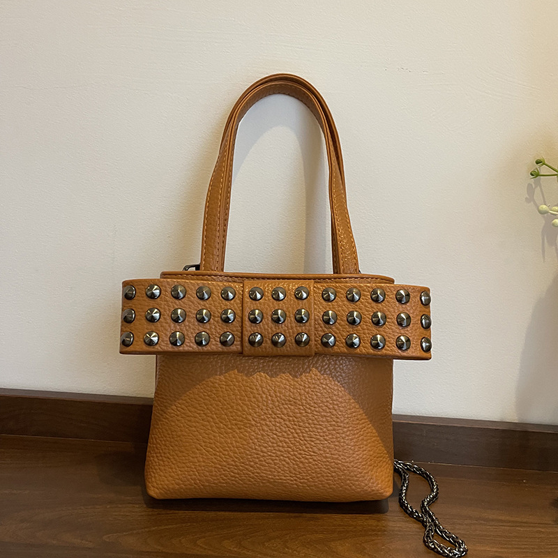 Bolso de textura transfronteriza 2025 nuevo bolso de cadena retro bowknot bandolera moda remache bandolera