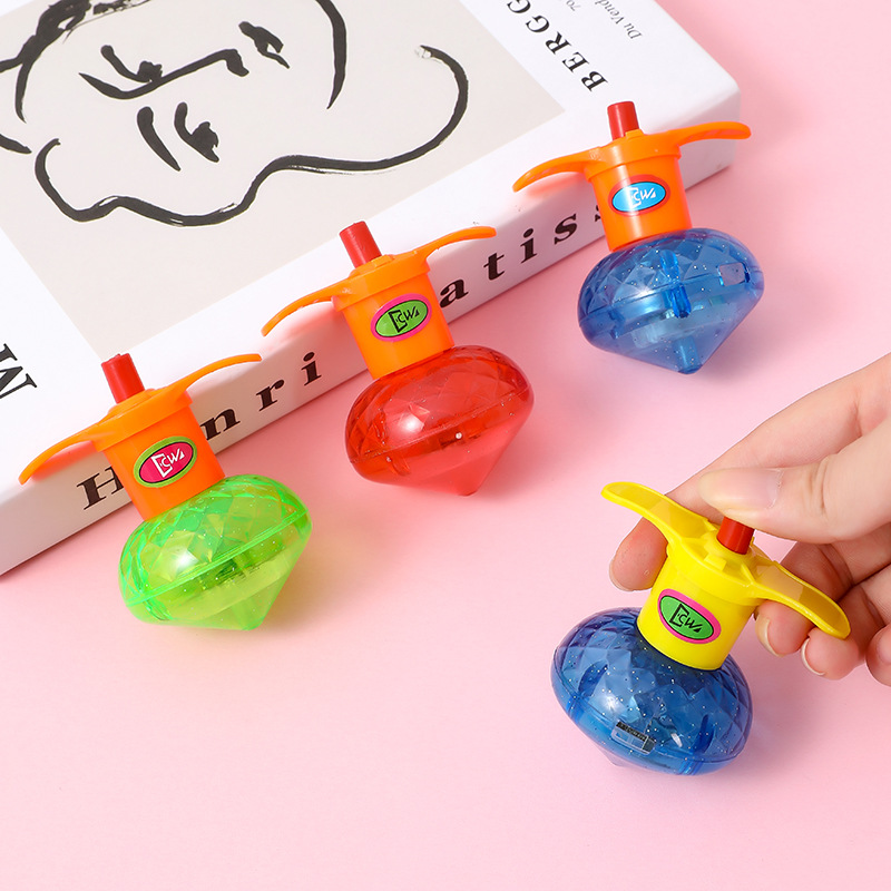 Emisión de luz torsion Gyro Toy puesto de mercado nocturno infantil regalo catapulta Gyro juguete emisor de luz al por mayor transfronteriza