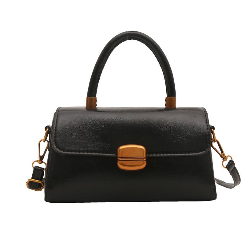 Nicho de diseño coreano bolso de mano 2025 primavera nuevo estilo simple de moda con cierre de flip de hombro monocolor bolso de mochila