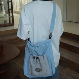 韩系大容蓝灰色抽绳双肩包2025新款百搭斜挎包学生上课背包书包