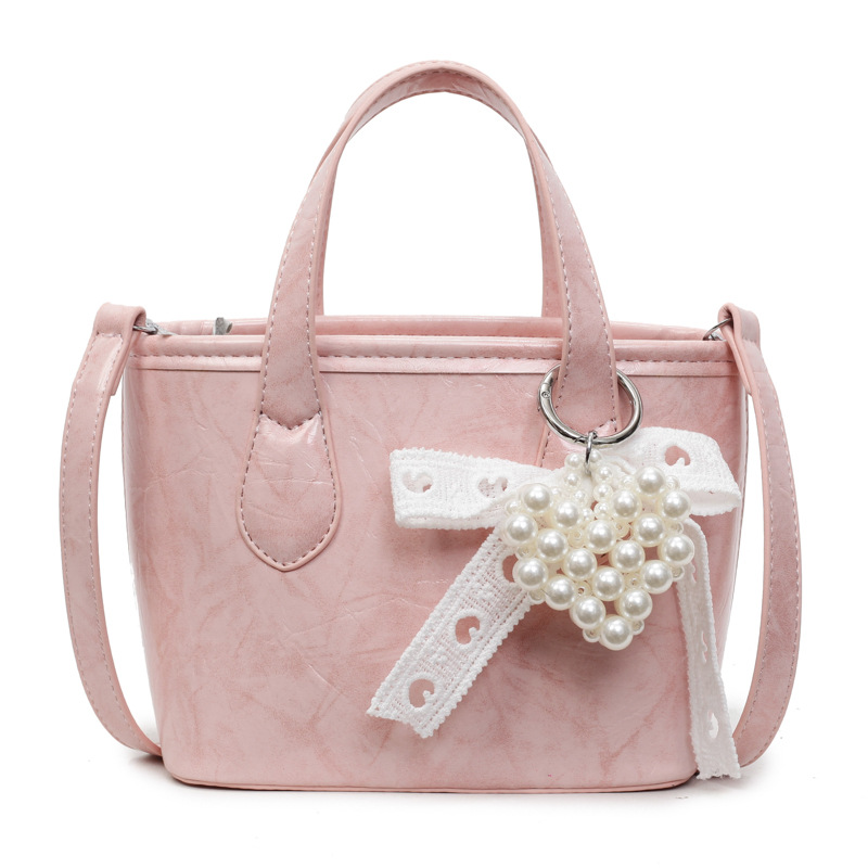 Bolso Tote popular de este año 2025 verano nuevo bolso bolso de hombro con patrón de agarre lindo bolso de mensajero de todo fósforo mujer