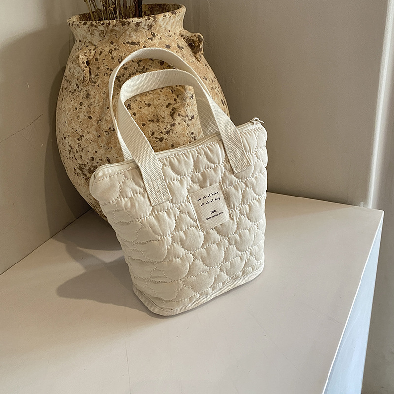 Bolsa de mano de estilo coreano de aire extranjero de gran capacidad, bolsa de ocio ligera, bolsa de mamá, nuevo tipo de bolsa de cubo para padres e hijos.