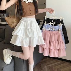 黒い半身のスカートの女性の春と秋の超火のナシの形の体つきの高い腰のa字のケーキのスカートの小さい背の蓬の短いスカート