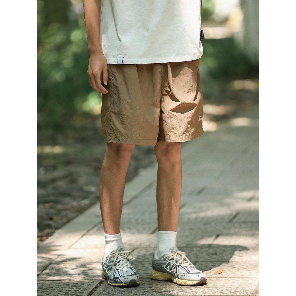 Verano al aire libre montañas y ríos pantalones cortos de color sólido para hombres pantalones de cinco puntos de playa sueltos de secado rápido comercio exterior al por mayor transfronterizo