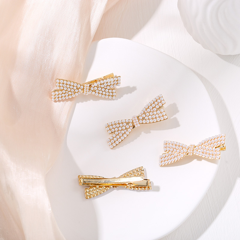 Super fairy Pearl bow hairpin hairpin South Korea Internet celebrity bangs clip side clip Mori temperament duckbill clip for children Super fairy Pearl bow hairpin hairpin South Korea Internet celebrity bangs clip side clip Mori temperament duckbill clip for children