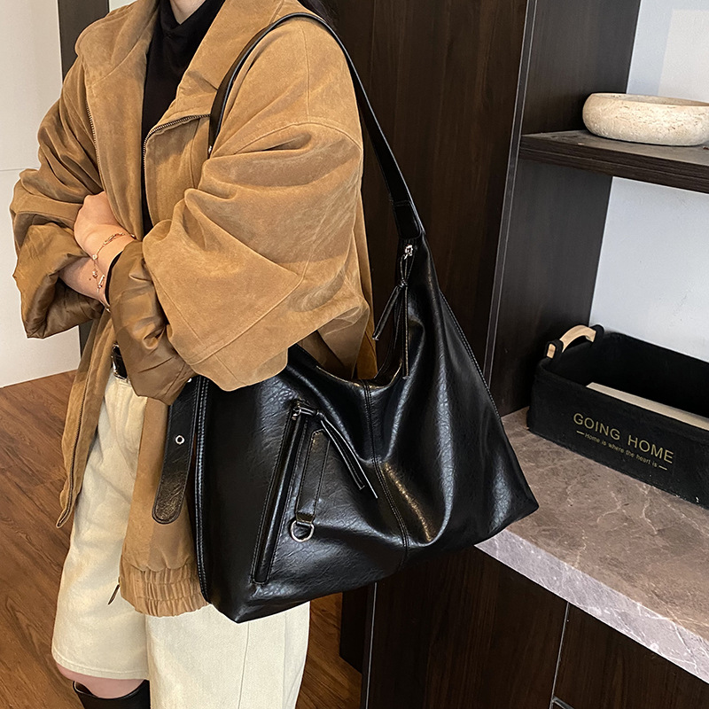 Bolsa de viaje retro de alta calidad para mujeres 2025 invierno nuevo estilo de moda multifuncional bolso de hombro de textura de moda bolso de brazo