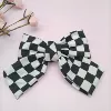 Black checkered-spring clip
