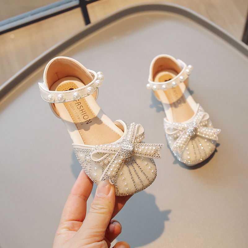 Zapatos de cristal para niñas 2026 verano nuevas sandalias de cabeza de bolsillo para niños pequeños zapatos de princesa suaves zapatos de baile de niñas