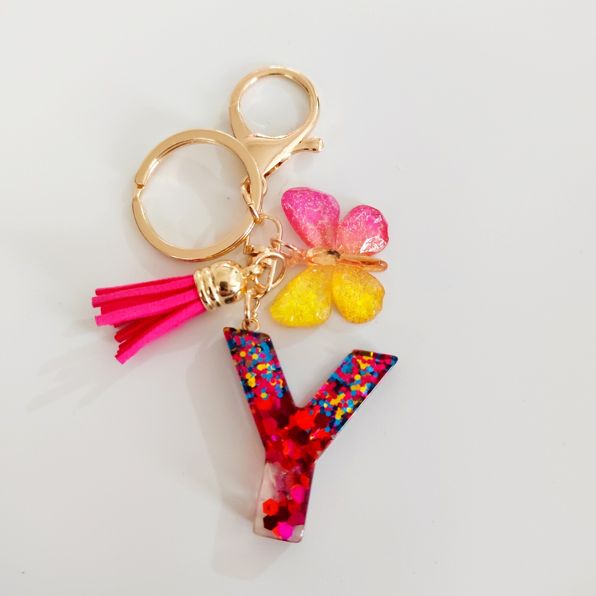 Ventas transfronterizas calientes de letras inglesas de color mixto colgante de llavero colgante de mariposa fringe de resina de llavero colgante de joyería