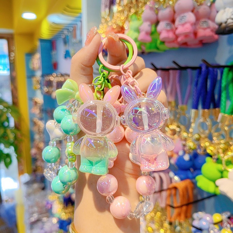 Nuevo colorido cuentas para usar auriculares bolsos de resina de conejo aeroespacial colgante de dibujos animados conejo llavero accesorios para estudiantes
