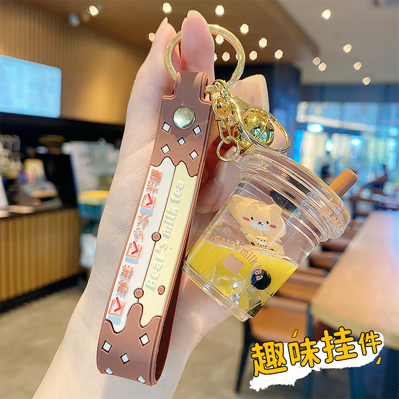 Perla leche taza de té oso colgante aceite flotante botella llavero femenino exquisito colgante mochila arenas movedizas colgante
