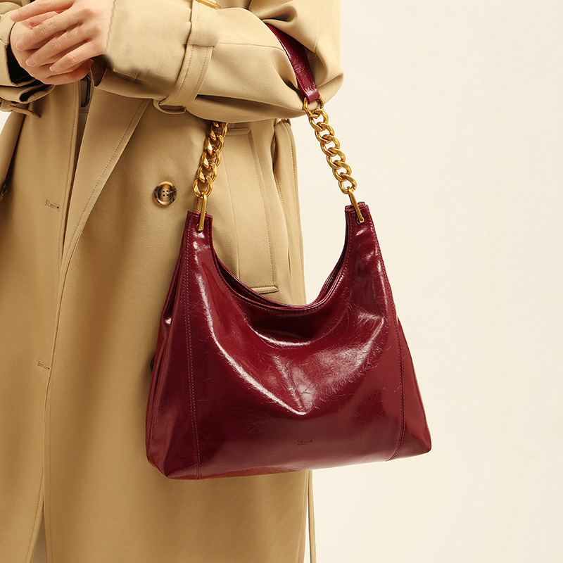 Capacious red one-shoulder bag for bride