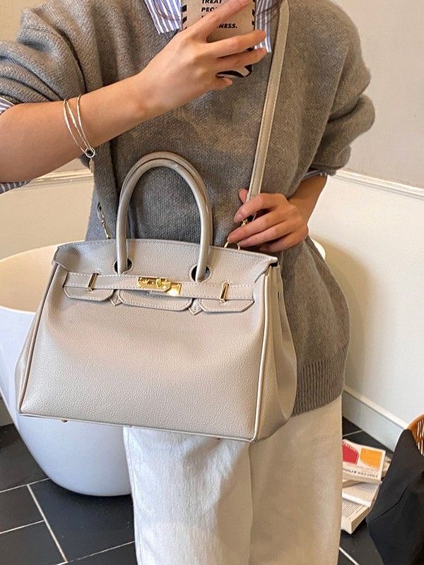 Bolsos de platino retro retro de alta calidad para mujeres 2026 comercio exterior nueva moda litchi pattern commuter mochila versátil