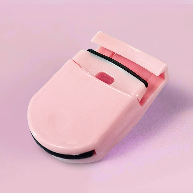 Small plastic eyelash curler