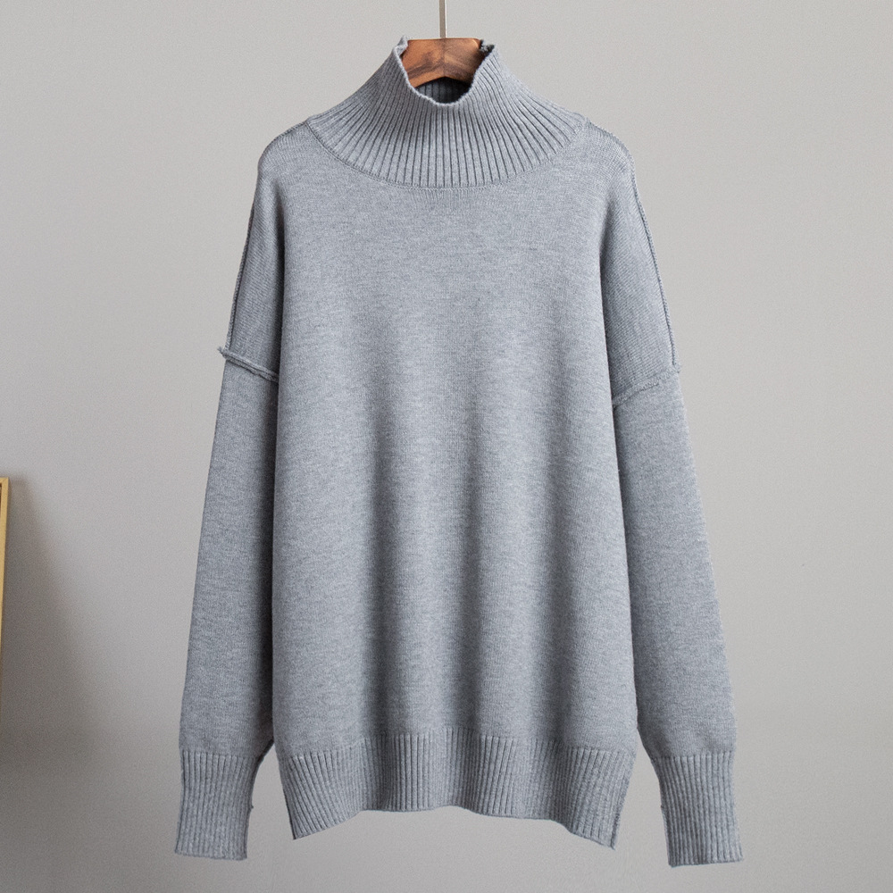 Suéter de cuello alto con costuras transfronterizas para mujer, otoño e invierno europeo y americano nuevo estilo casual suelto perezoso suéter grueso suéter de punto