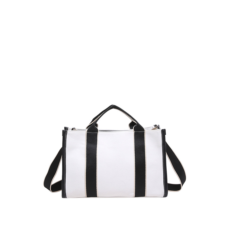 2024 invierno nuevo estilo de moda coreana ins bolso de lona de gran capacidad de viaje bolso de hombro bolso de colisión de color