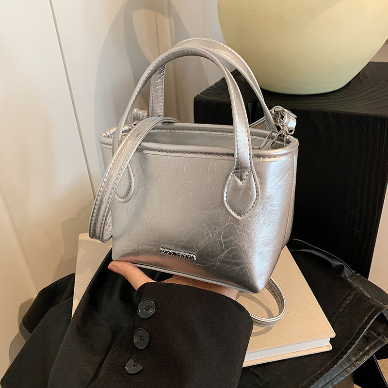 Bolso popular de este año, bolso de moda de mujer de textura alta, bolso de mochila, bolso de cubo portátil, bolso de mujer de verano