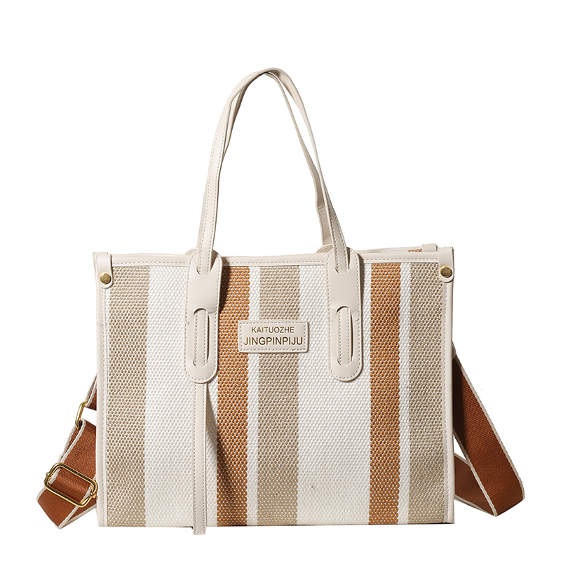 Bolso Tote portátil a rayas de color de contraste de lona para mujer 2024 nueva textura de moda transfronteriza bolso de mensajero de un solo hombro