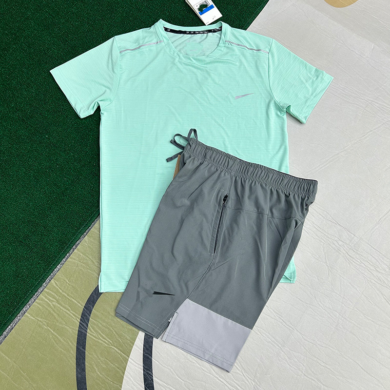 Mayorista nuevo juego de comercio exterior deportivo fitness juego de carrera rápida secado transpirable suelto ocio pantalones cortos de manga corta ropa de hombre