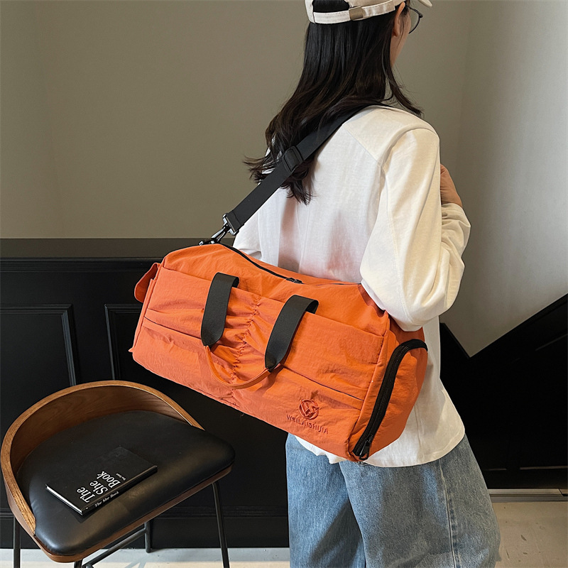 Bolso deportivo coreano transfronterizo femenino 2025 nueva bolsa de almacenamiento separada seca y húmeda bolsa de viaje de viaje