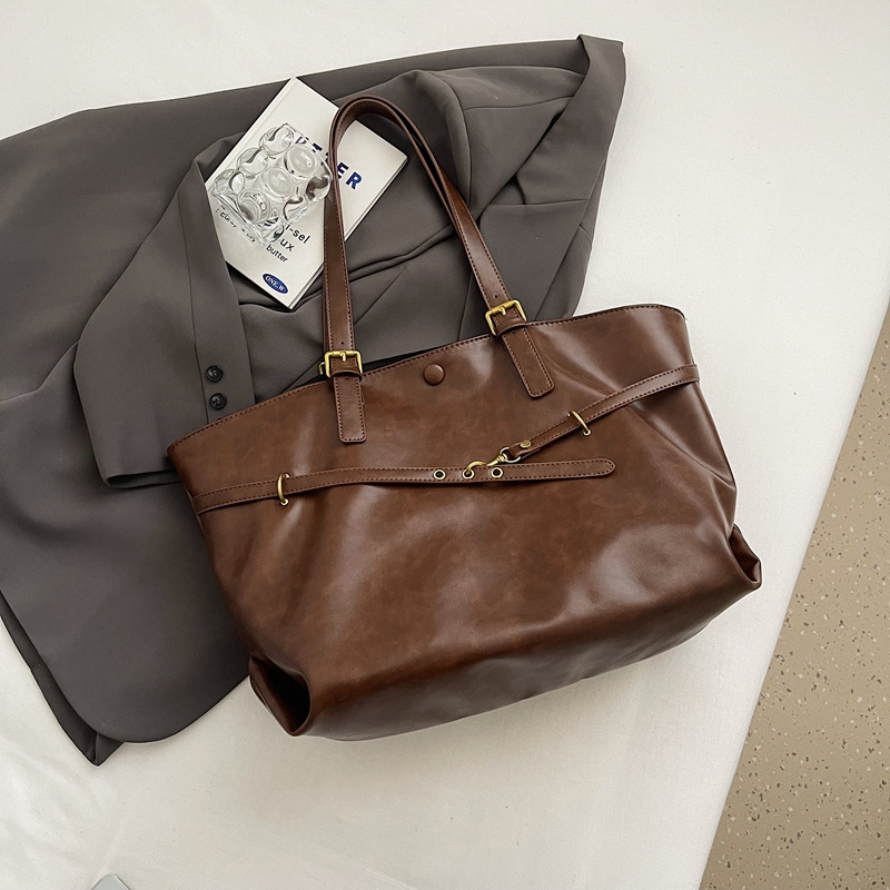 Bolsos de mujer Bolsos de alta capacidad portátiles de todo fósforo 2025 nuevo estilo retro moda casual bolso de hombro sentido bolso de mujer