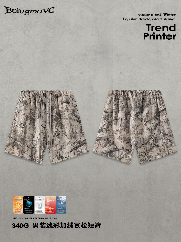 Calle secada| 2025 otoño y invierno americano camuflaje callejera impresión de transferencia térmica de terciopelo pantalones cortos sueltos pantalones casuales para hombres