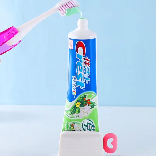 Toothpaste squeezing tool, creative and simple seat-type toothpaste holder, facial cleanser press, children's manual toothpaste squeezing device