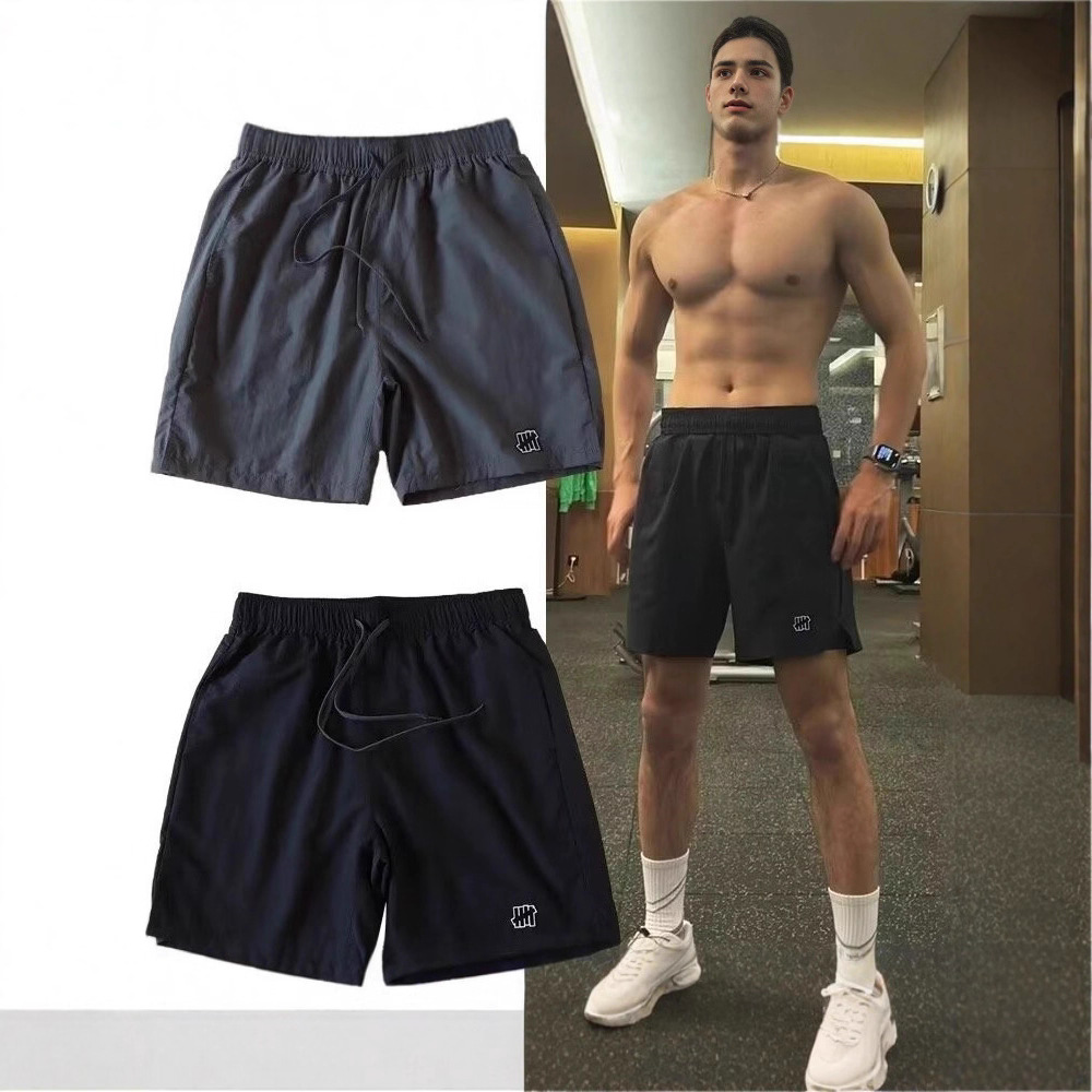 Shorts esportivos casuais americanos de secagem rápida para homens, shorts casuais versáteis e elegantes para praia.