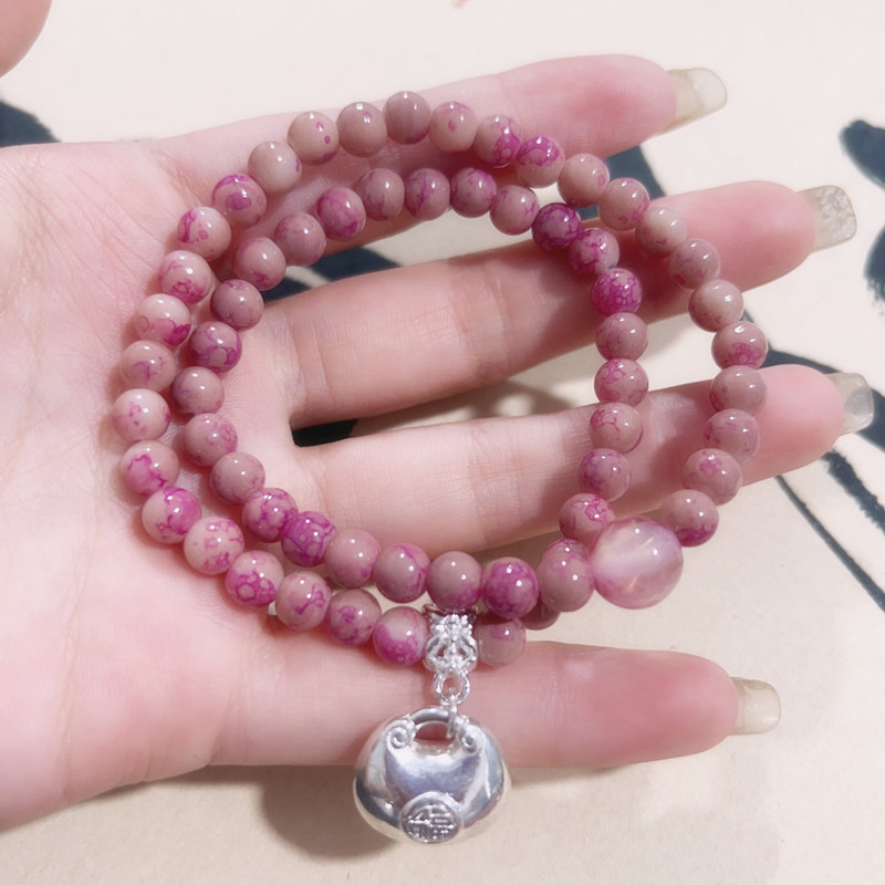 Bracciale con perline rosa e ciondolo portafortuna donna_voghion.com